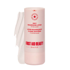 First Aid Beauty lactic acid lotion bottle for resurfacing and hydration.