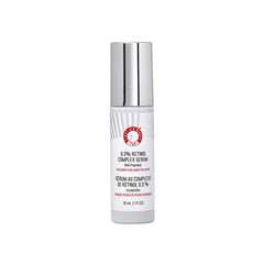 First Aid Beauty Retinol Complex Serum bottle on bathroom counter, gentle for sensitive skin.