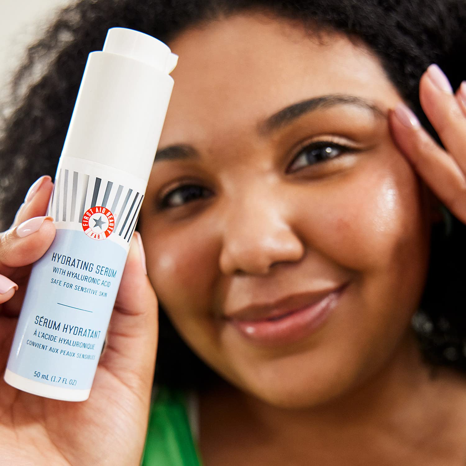First Aid Beauty serum texture close-up shows fast-absorbing, non-sticky feel.