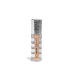 Fitglow Conceal+ bottle closeup showing creamy texture for seamless, crease-resistant coverage.