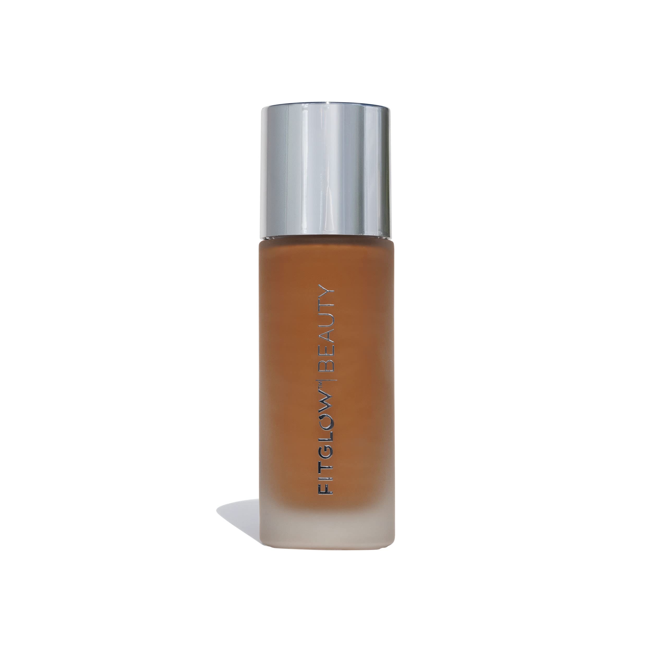 Fitglow Beauty Foundation+ bottle close-up shows vegan packaging for a natural finish