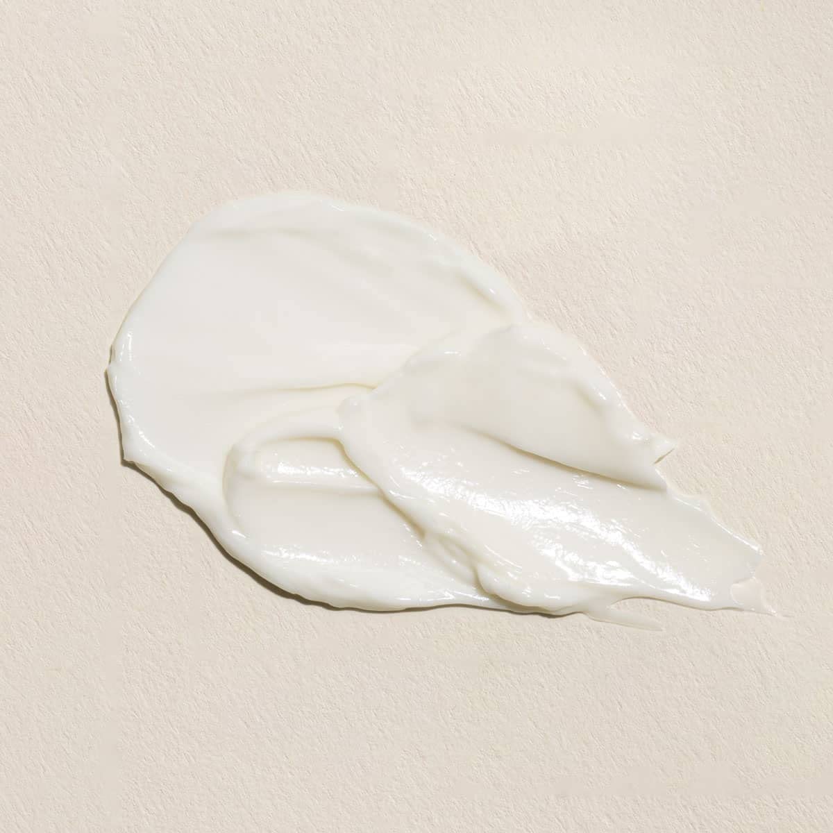 Close-up of Fleur & Bee ingredients featuring caffeine and peptides for brightening.