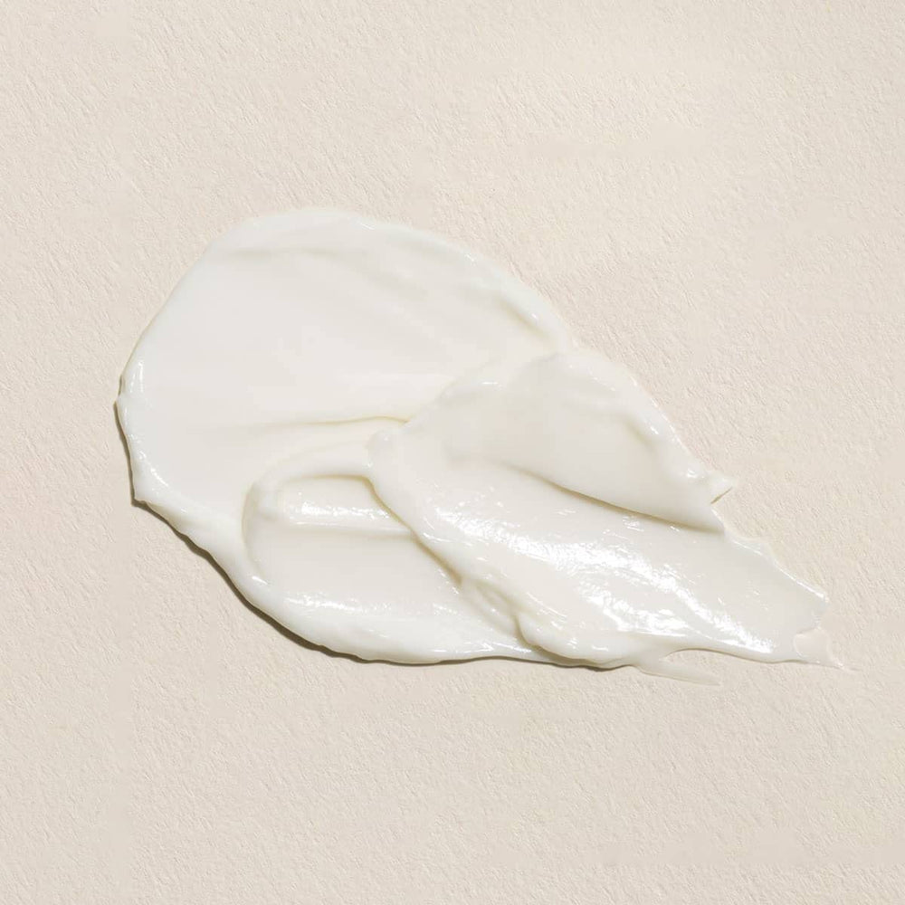 Close-up of Fleur & Bee ingredients featuring caffeine and peptides for brightening.