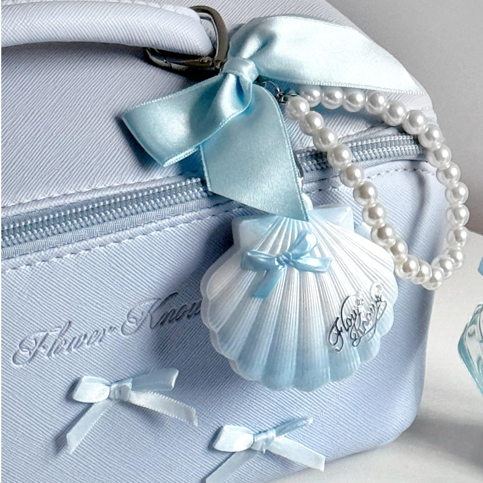 Flower Knows ivory shell design adds elegant, gift ready appeal.