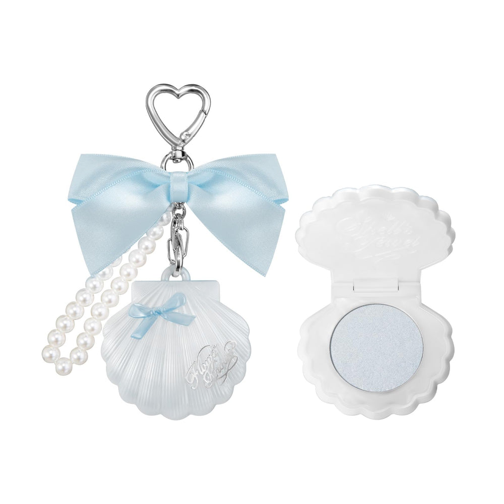 Flower Knows Shells Jewel Highlighter Balm in Blue Tears adds icy sapphire shimmer.