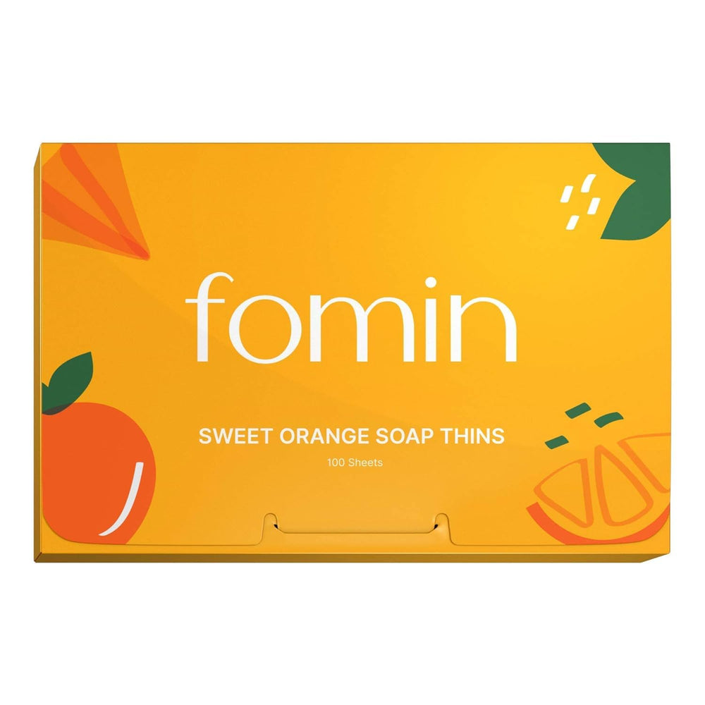 FOMIN paper soap sheets in orange packaging, travel-ready.