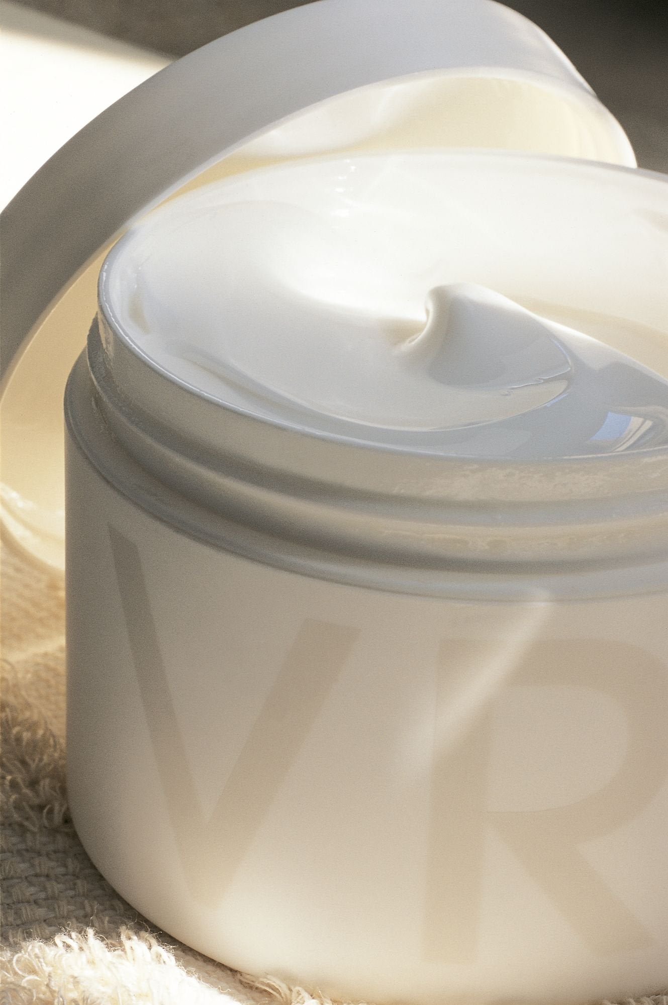 Fragonard VRAI Luxurious Body Cream packaging in soft white for elegant display