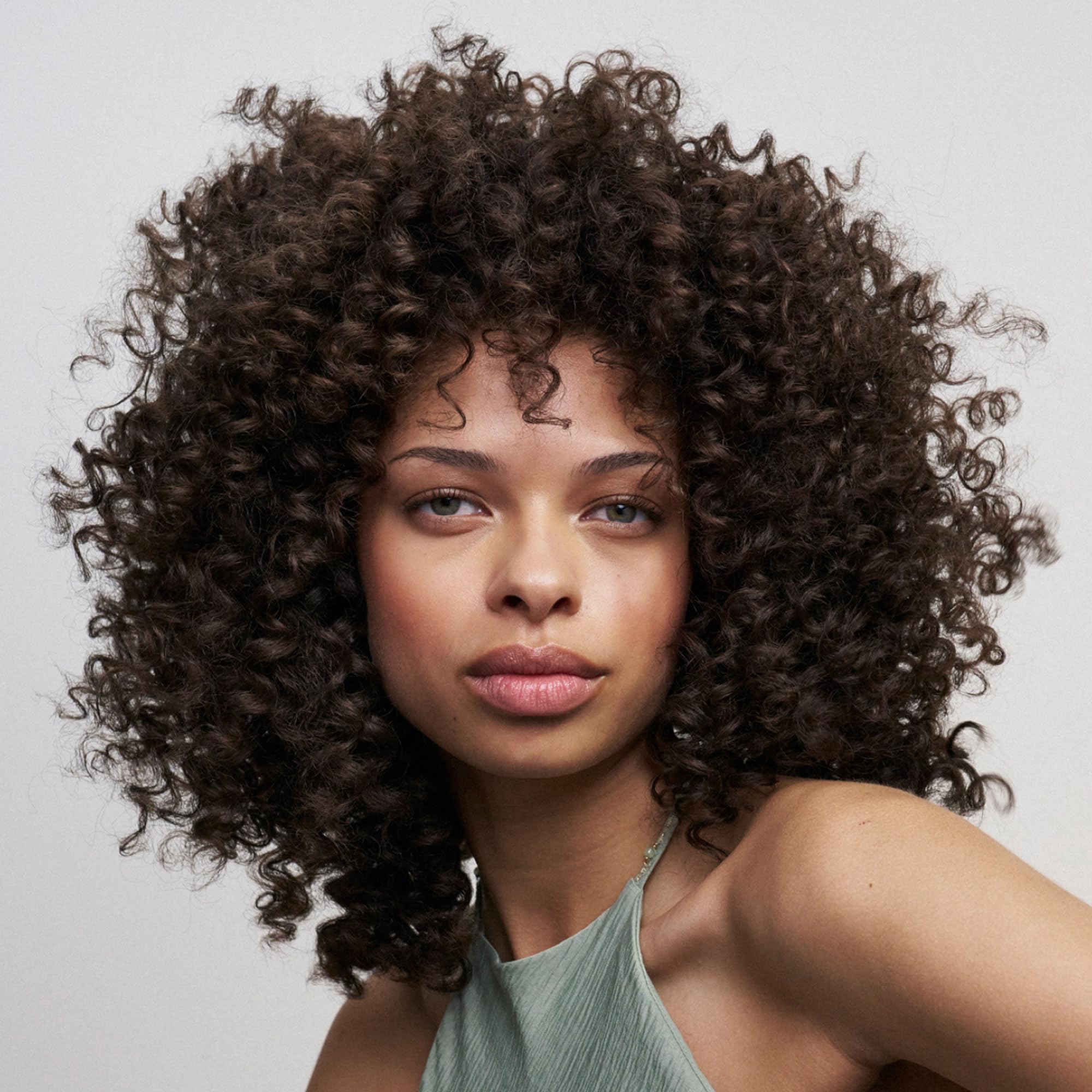 Air-dry use of Freewill Curl Defining Gel Cream on styled curls.