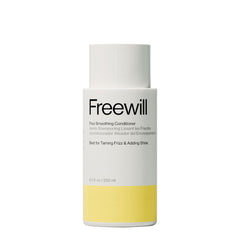 Freewill Frizz Smoothing Conditioner bottle pour showing frizz control benefits