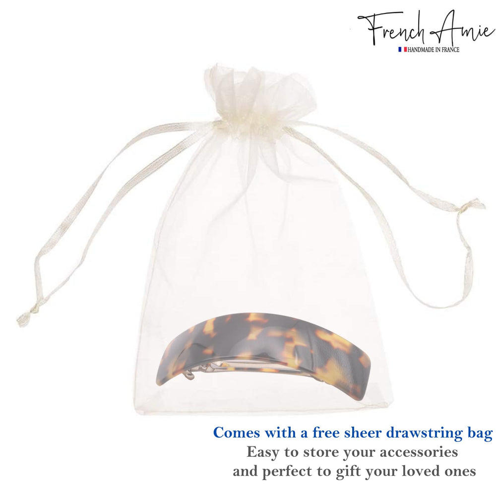 French Amie Curved Tokyo large clip shiny celluloid finish catches light beautifully.