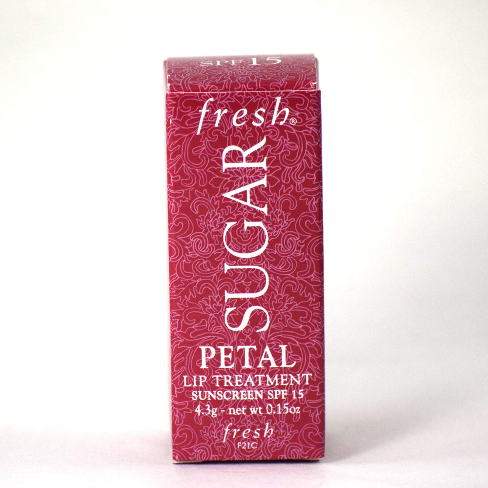 Fresh Sugar Lip Treatment Petal packaging closeup, compact travel-friendly design.