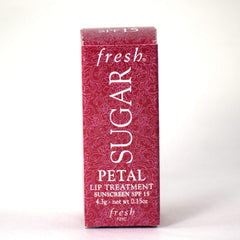 Fresh Sugar Lip Treatment Petal packaging closeup, compact travel-friendly design.