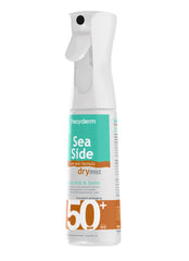 FREZYDERM Sea Side Dry Mist SPF 50+ spray applied to skin outdoors