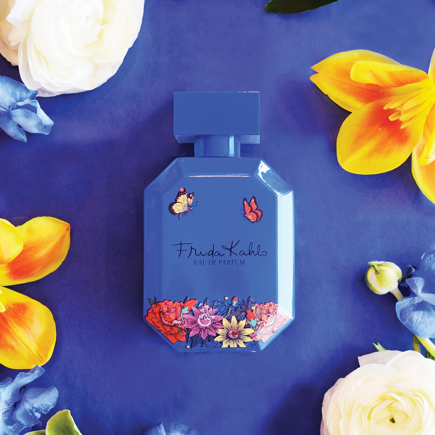 Close-up of Frida Kahlo Blue Deluxe bottle showing vibrant color and design.