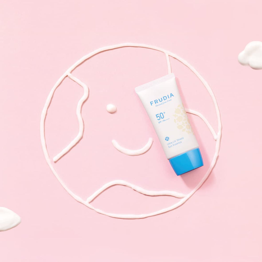 FRUDIA Welcos Sun Block Day Cream Essence on hand demonstrates quick, even blending for natural look.