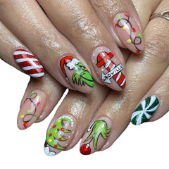 FUKIDOG nails showcase a green monster design on short almond shapes.