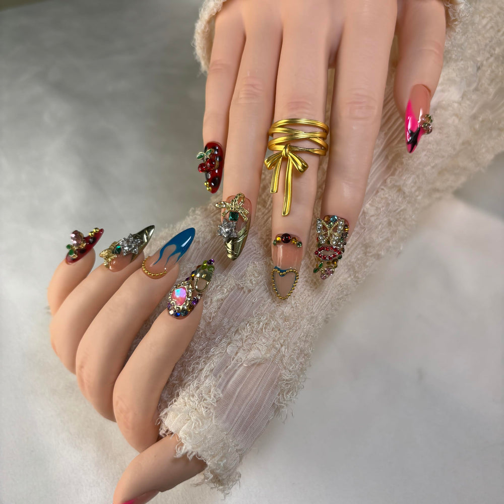 Furnunubi almond press-on nails featuring crystal hearts and 3D flowers for luxe detail.