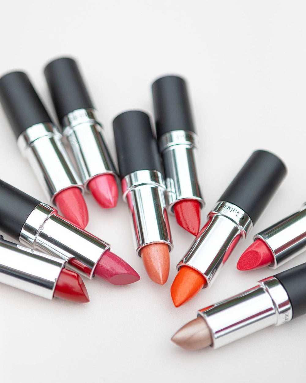 Gabriel Cosmetics Lipstick Aurora Bronze-Neutral Pearl shade variation on diverse skin tones.