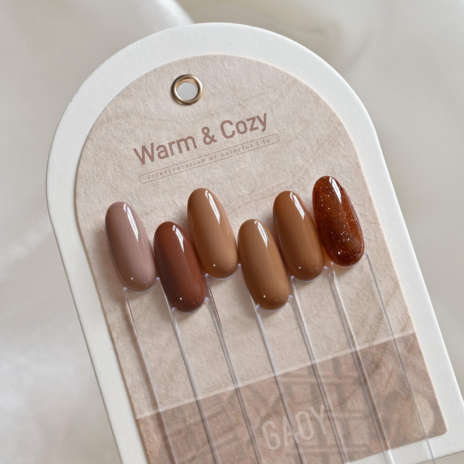 GAOY Hazelnut Chocolate gel nail polish bottle close-up to emphasize texture and color depth.