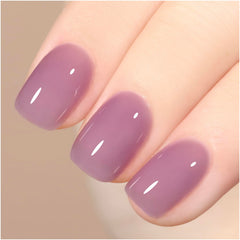Close-up of brush applying GAOY jelly nude purple gel polish