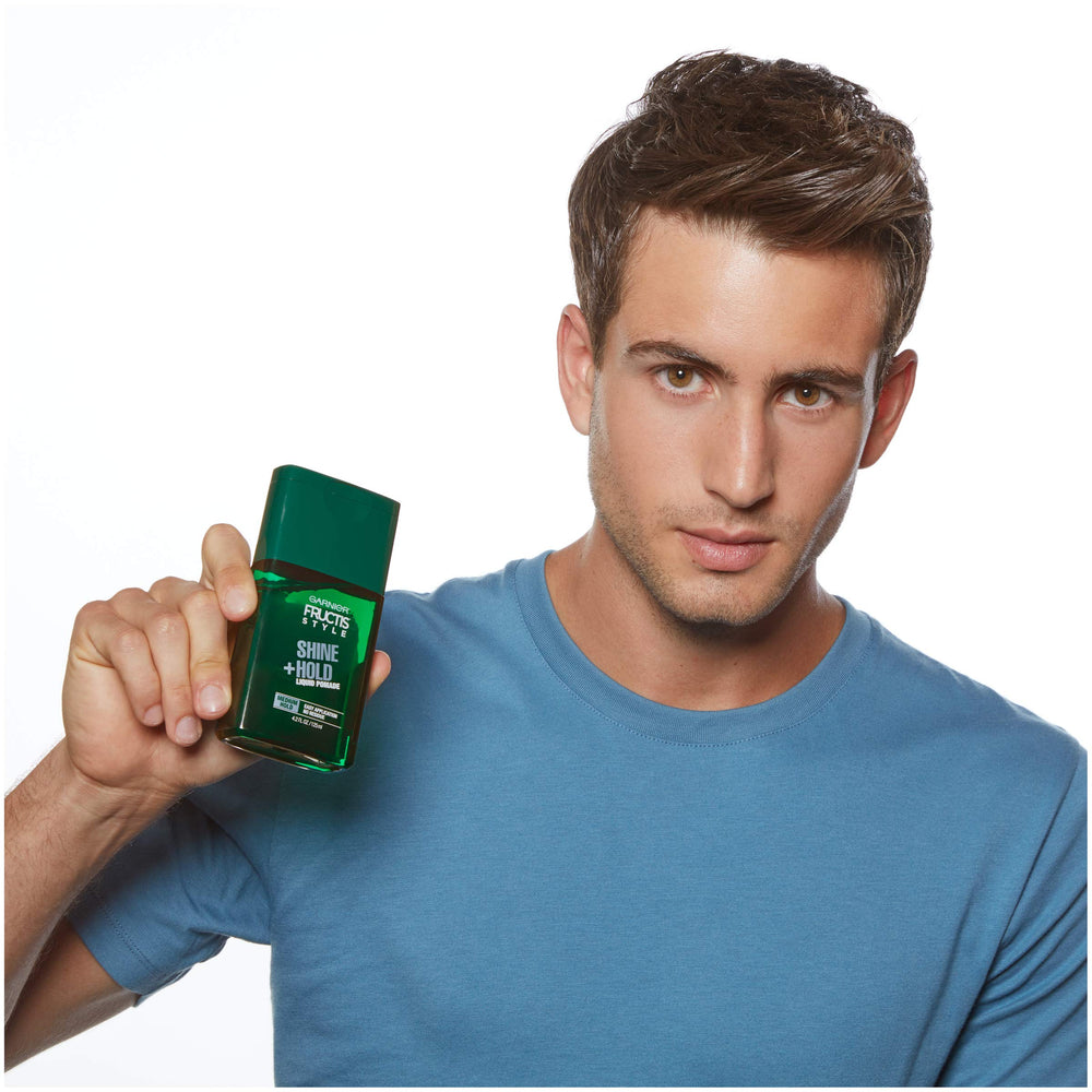 Garnier Fructis Style Shine and Hold product in a styling setup for men