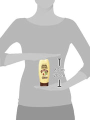 Garnier conditioner applied to hair, highlighting smooth, frizz-free results