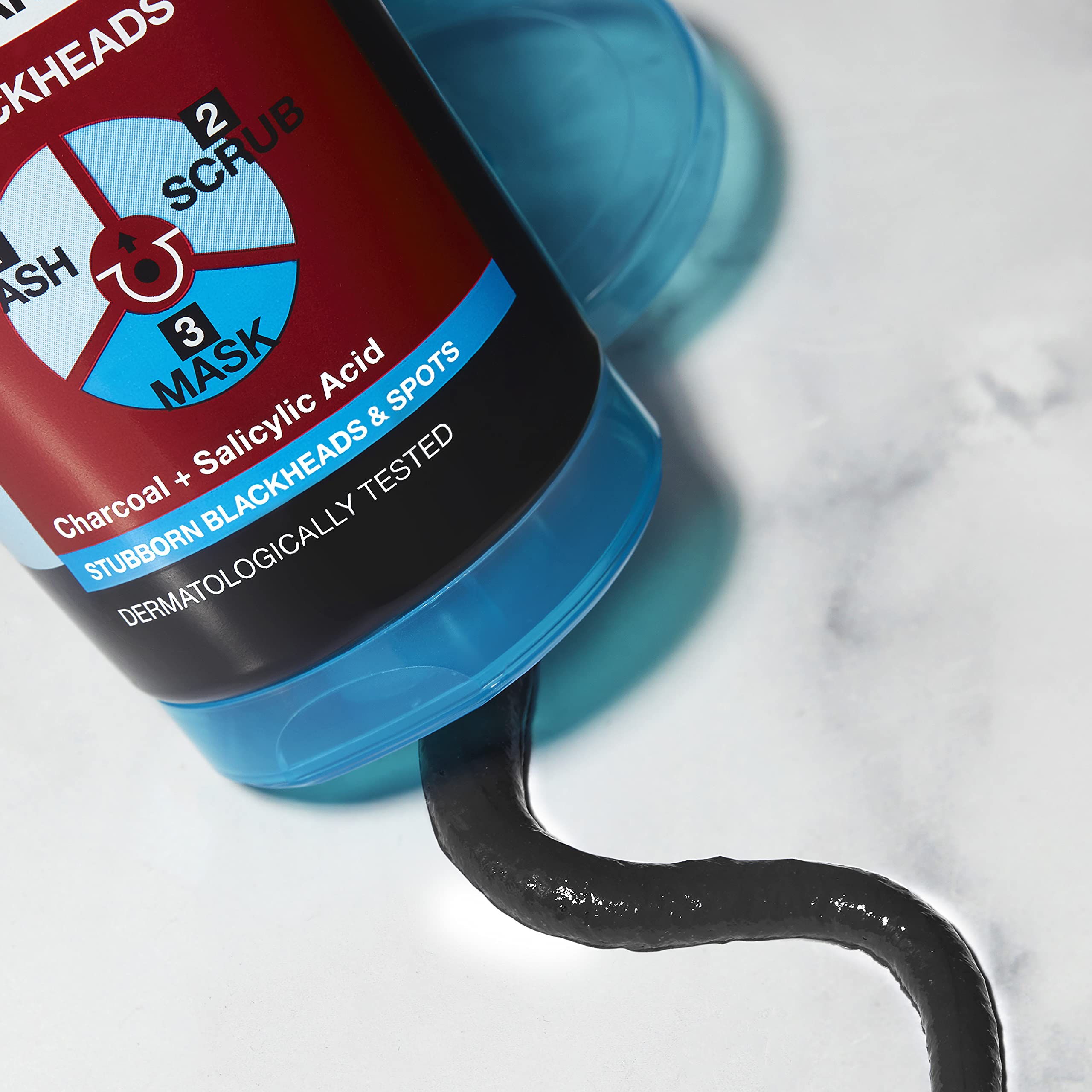 Garnier Skin Active Pure Active Charcoal Wash bottle on counter highlighting purifying formula for daily use.