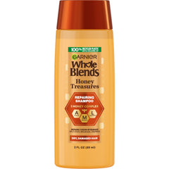 Garnier Whole Blends Honey Treasures Shampoo bottle ready for nourishing cleanse.