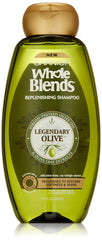 Garnier Whole Blends Legendary Olive shampoo bottle highlights a nourishing formula for dry hair.