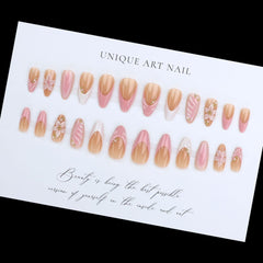 GCSQW nails featuring gold bead accents for elegant details