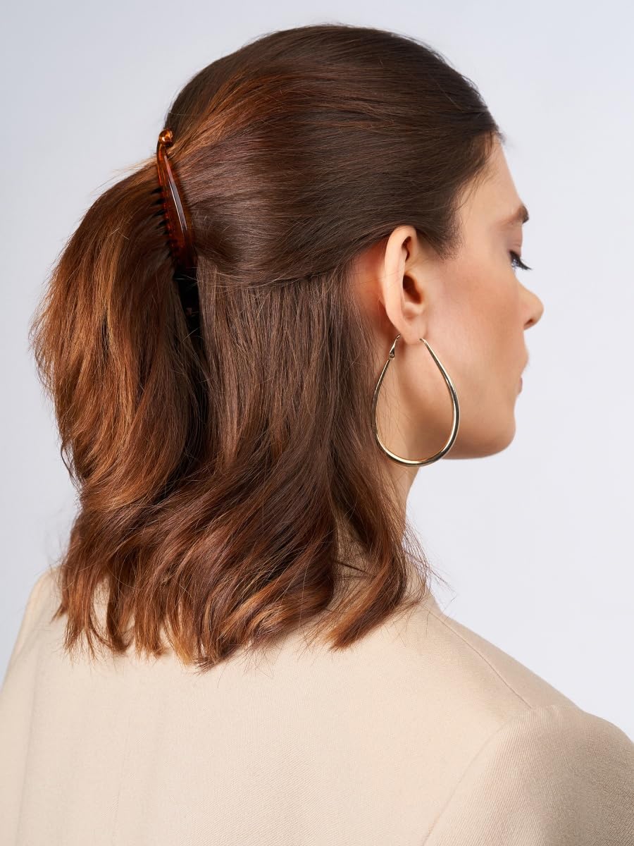 Generic banana clips inner teeth grip hair securely without snagging.