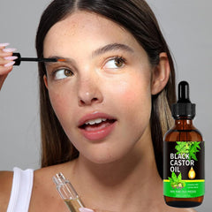 Generic castor oil bottle closeup on label highlights cold-pressed, natural ingredients for healthy skin.