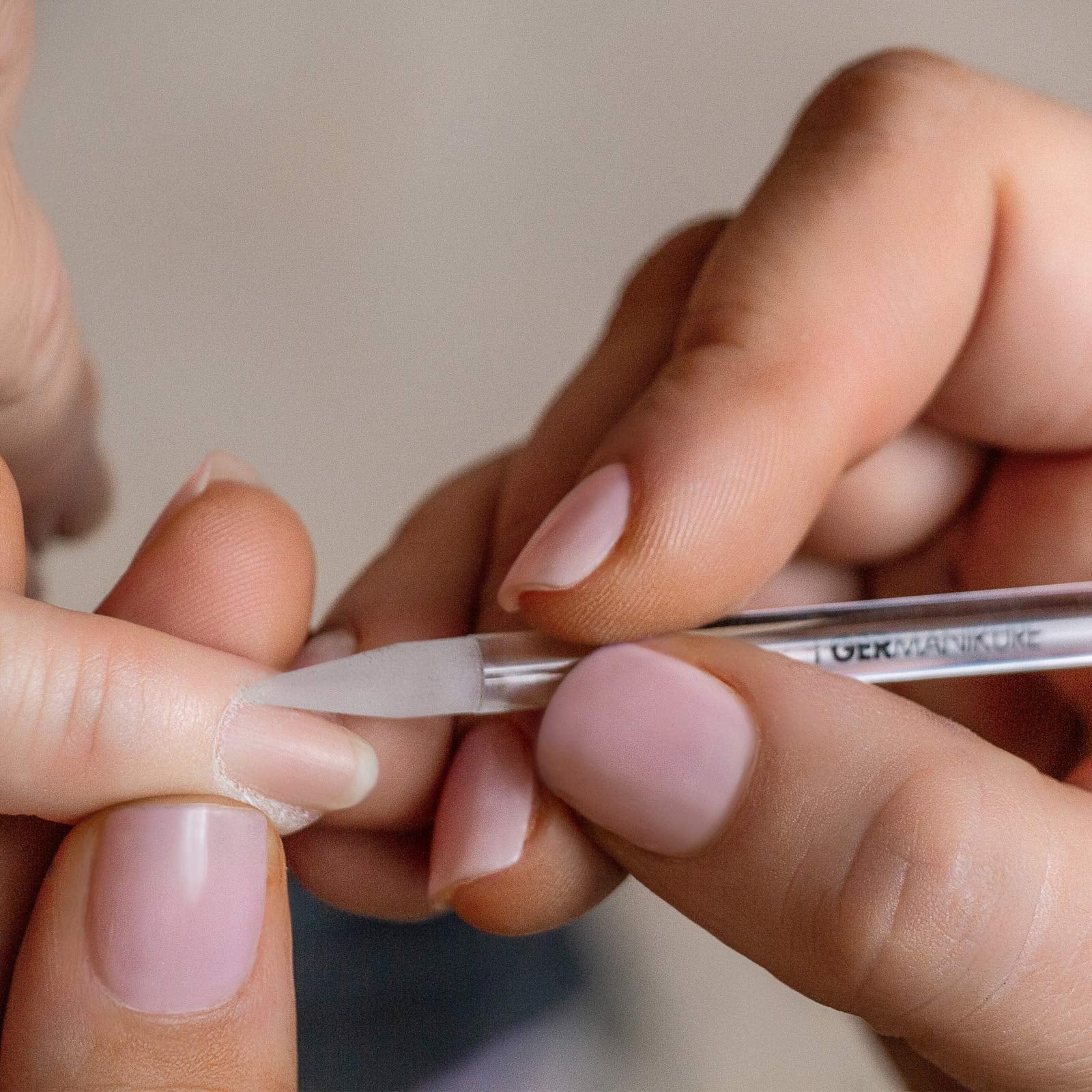 GERmanikure Glass Cuticle Stick shape-nails with clean, precise edges.