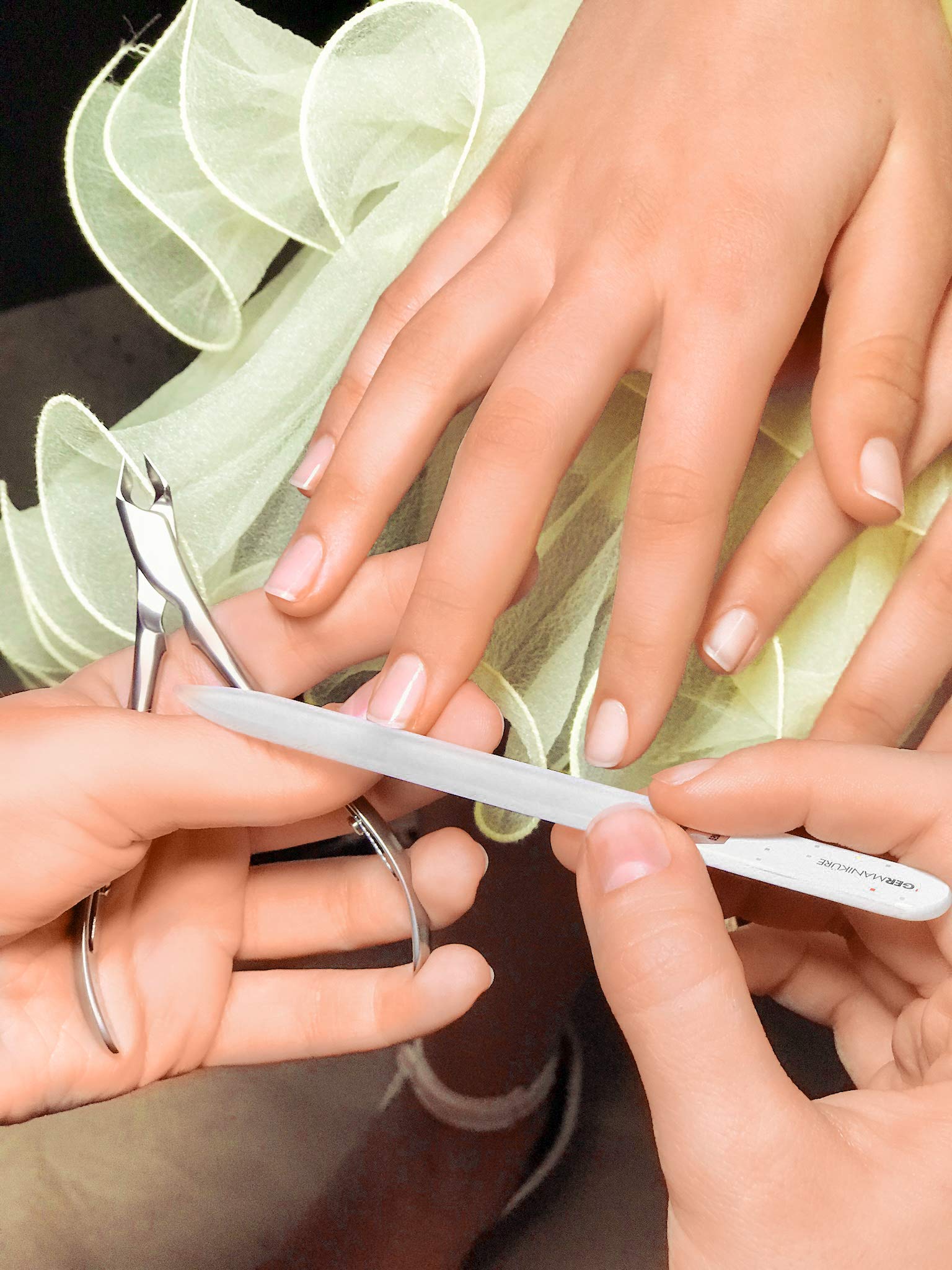 GERmanikure glass files in action on natural nails for gentle shaping.