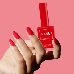 GGDECA coral gel nails on fingers show smooth coverage.