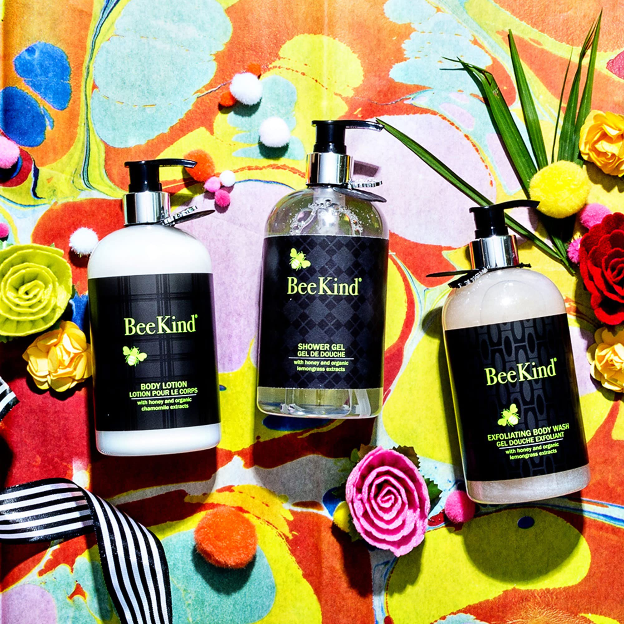 BeeKind lotion being applied to hands demonstrates versatile body care.
