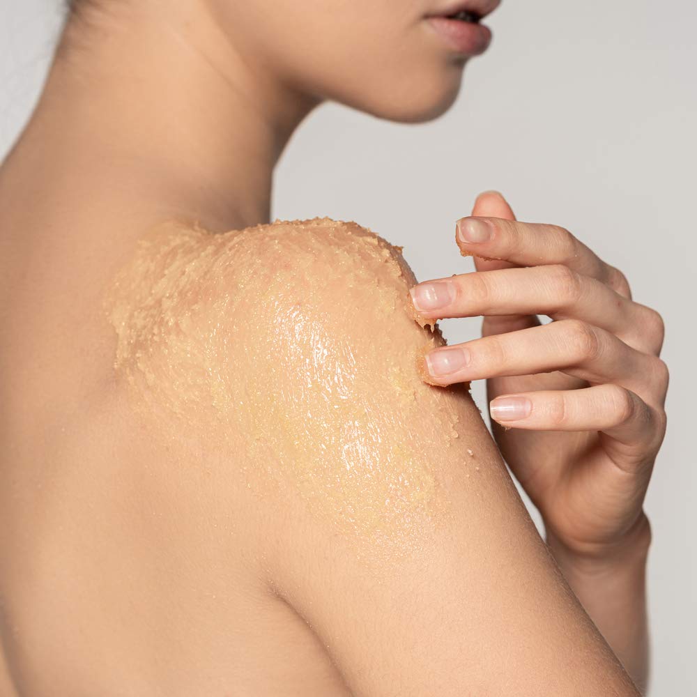 Ginger Lily Farms Botanicals Body Scrub being applied for exfoliation on skin