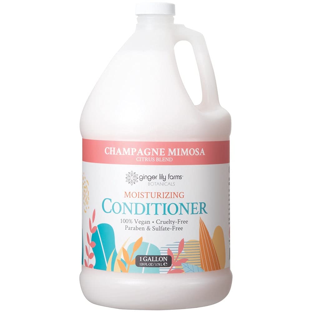 Ginger Lily Farms Champagne Mimosa conditioner bottle pour nourishes and smooths hair.