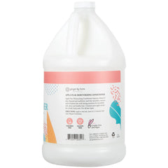 Ginger Lily Farms Apple Pear conditioner pour bottle shows hair after use.