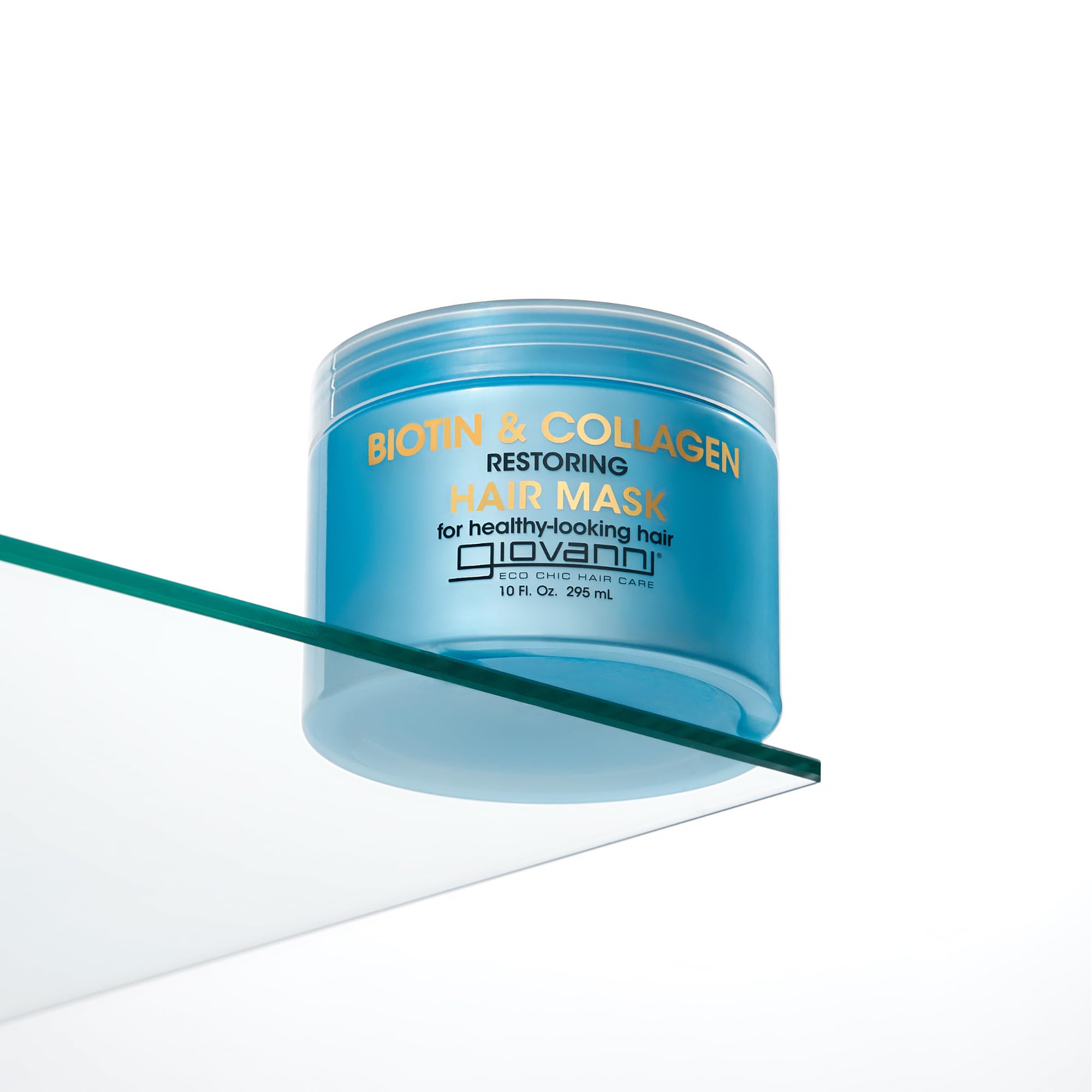 GIOVANNI Biotin & Collagen Hair Mask on hair strands suggests improved moisture and bounce.