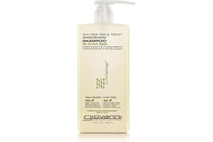 Giovanni Tea Tree Triple Treat Shampoo bottle promotes refreshing cleansing and scalp revival.