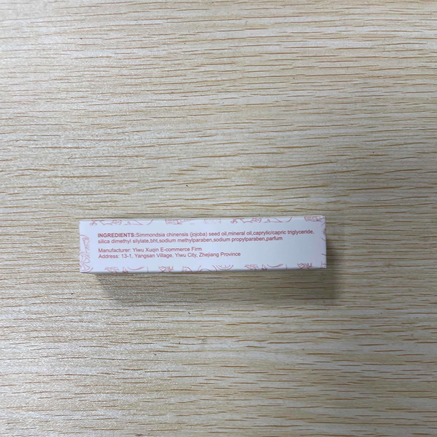 Gireatick lip oil packaging flatlay showing compact design