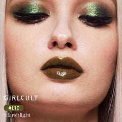 GIRLCULT gloss lipstick swatch displaying luminous shine on skin.