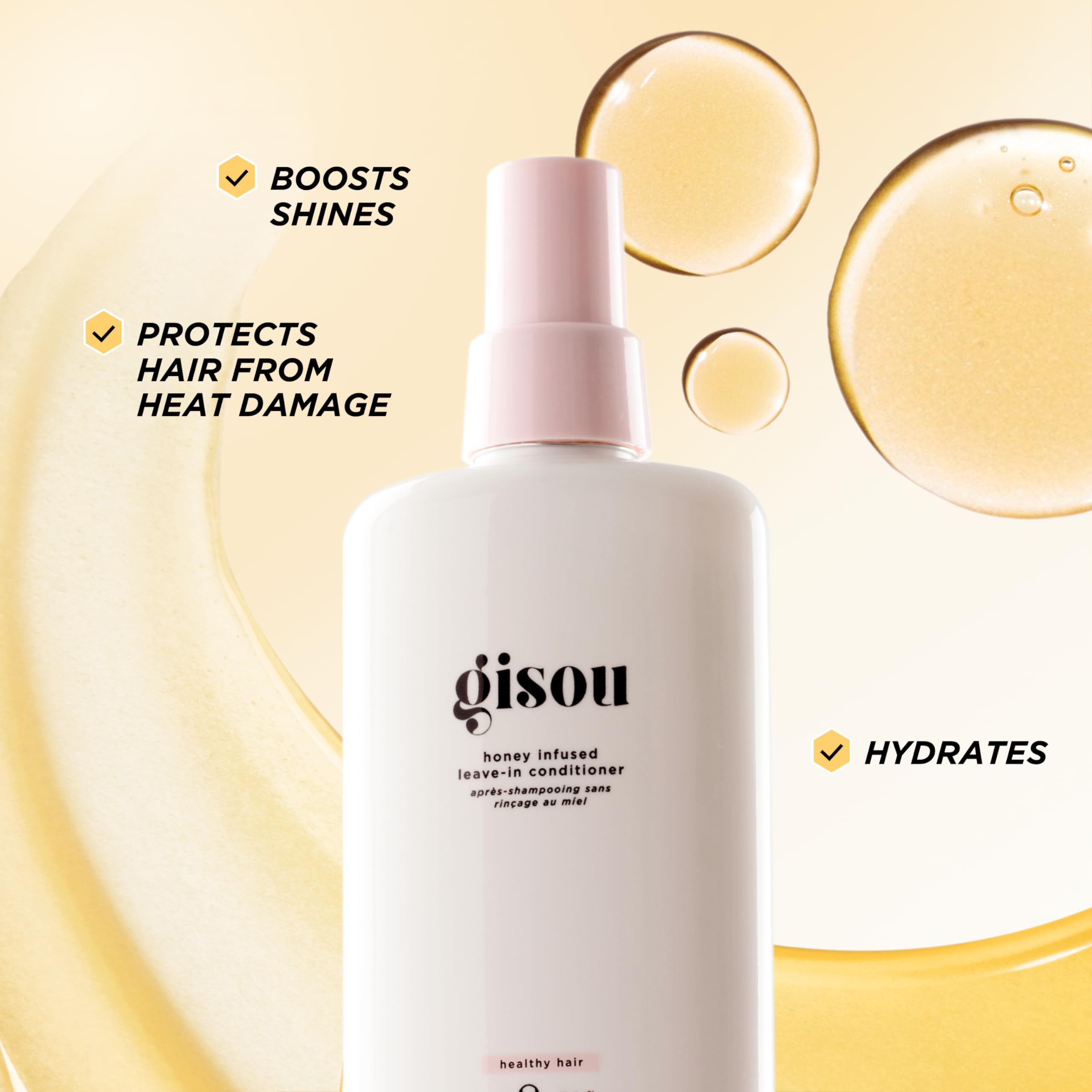 Gisou leave-in application on damp hair for smoother brushing and frizz control.