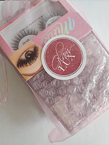 Glam Lux Powder Blush adds a soft, buildable rosy tint for dimension.