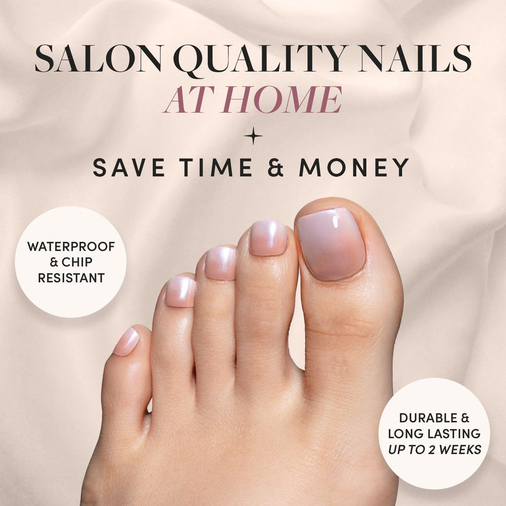 Fiancéd nude-to-white ombré toenails for bridal-inspired, breezy look.