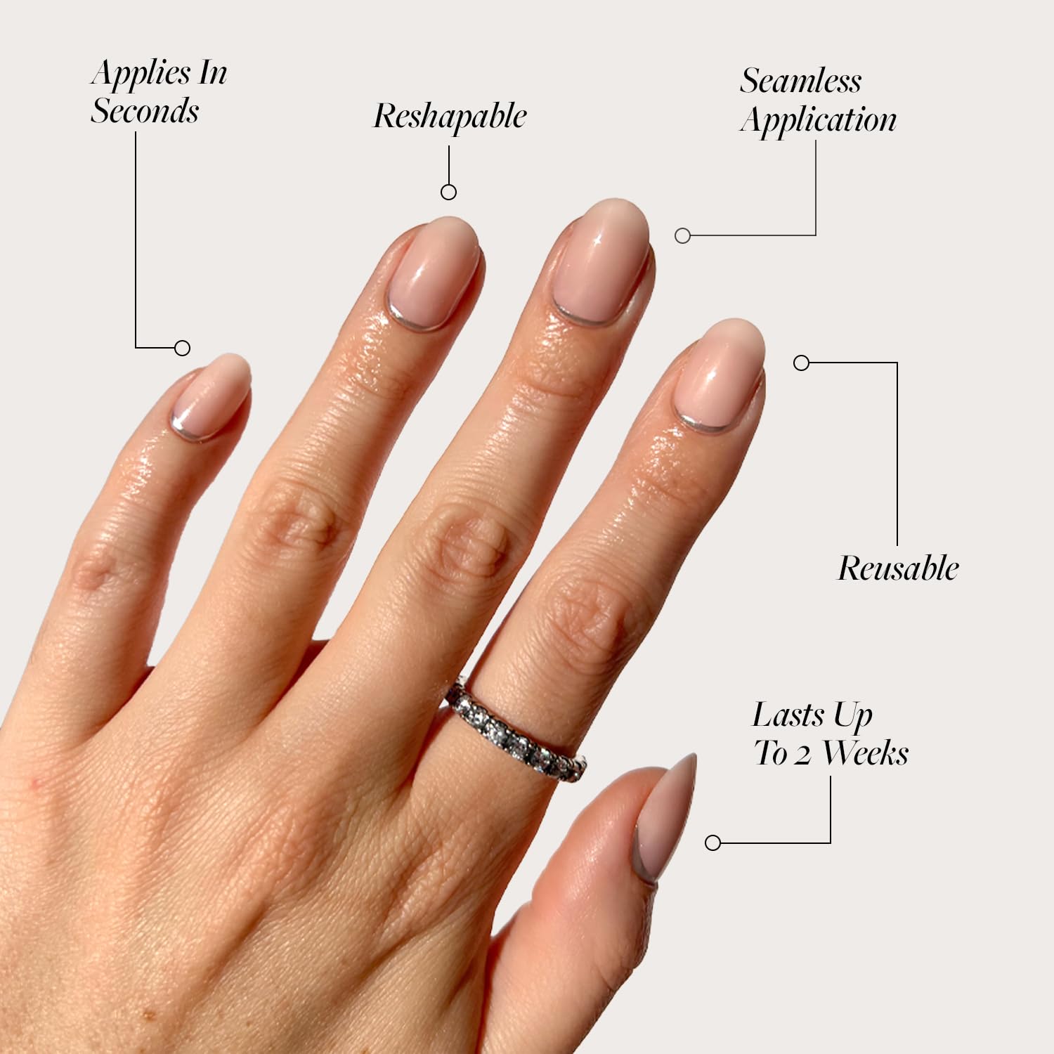 Glamnetic nails feature 3D silver foil on a natural short-round base.