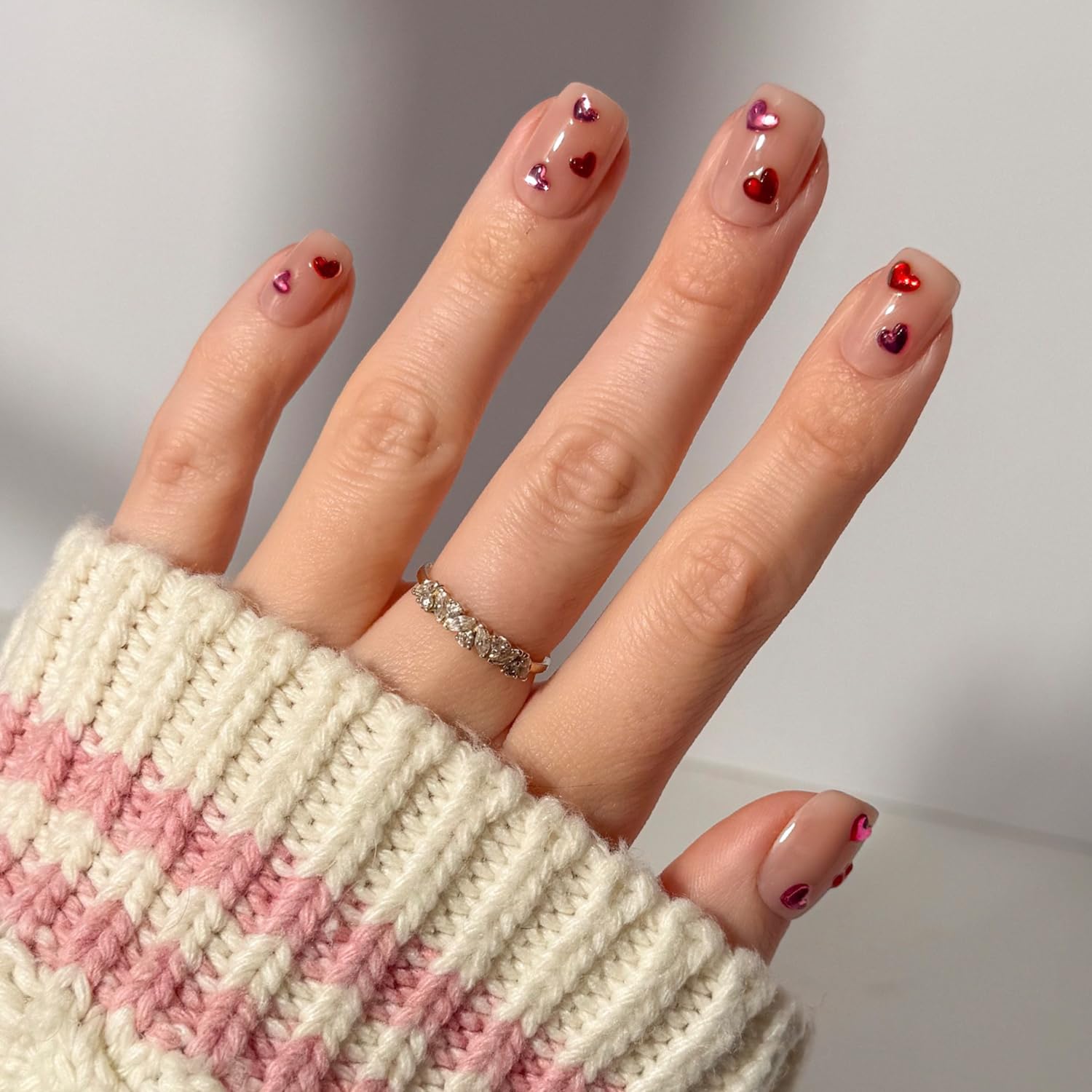 Glamnetic Dear Lover nails close-up with detailed 3D heart accents for a date-night statement