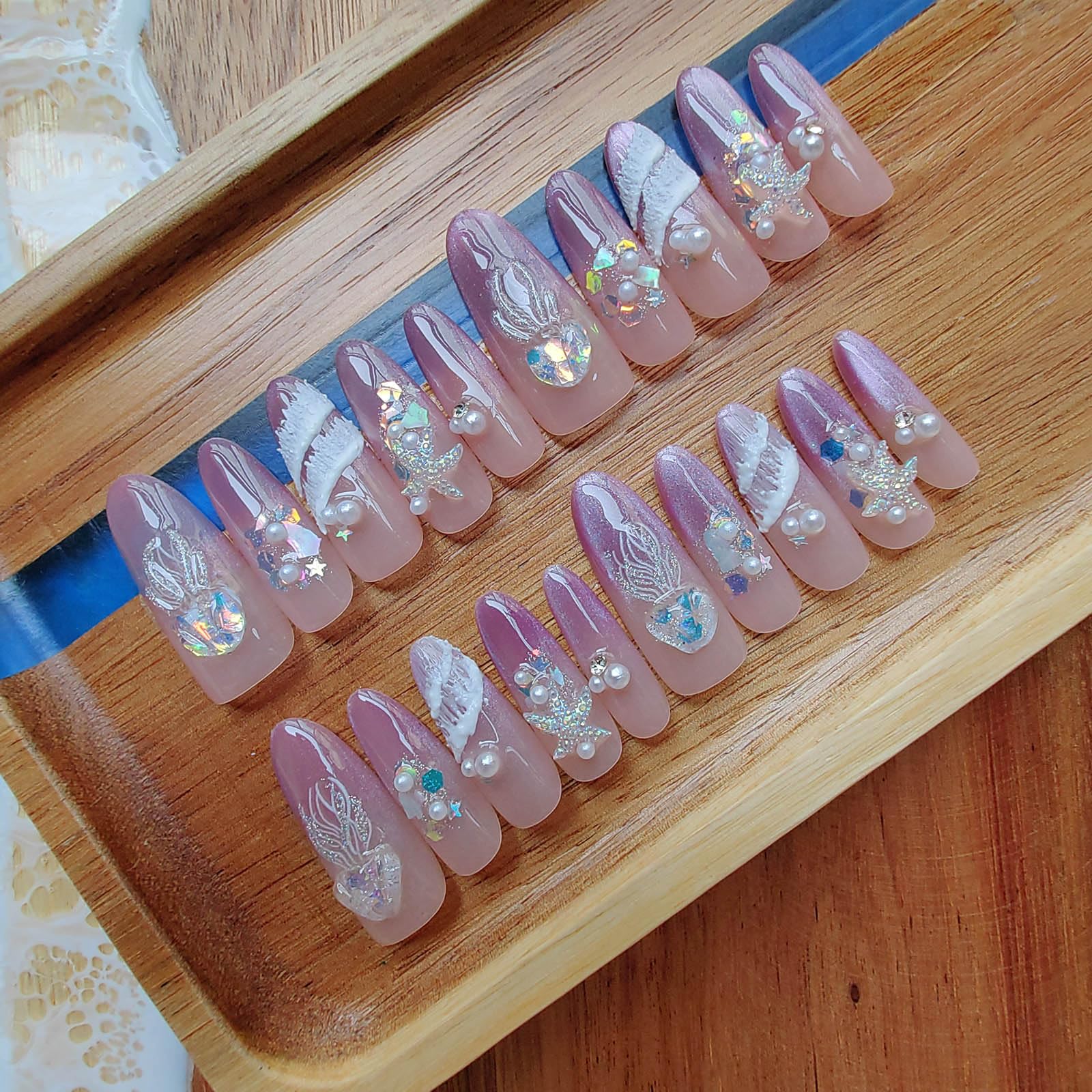 Gleamrain 3D handmade press-on nails in long almond shape offer durable wear.