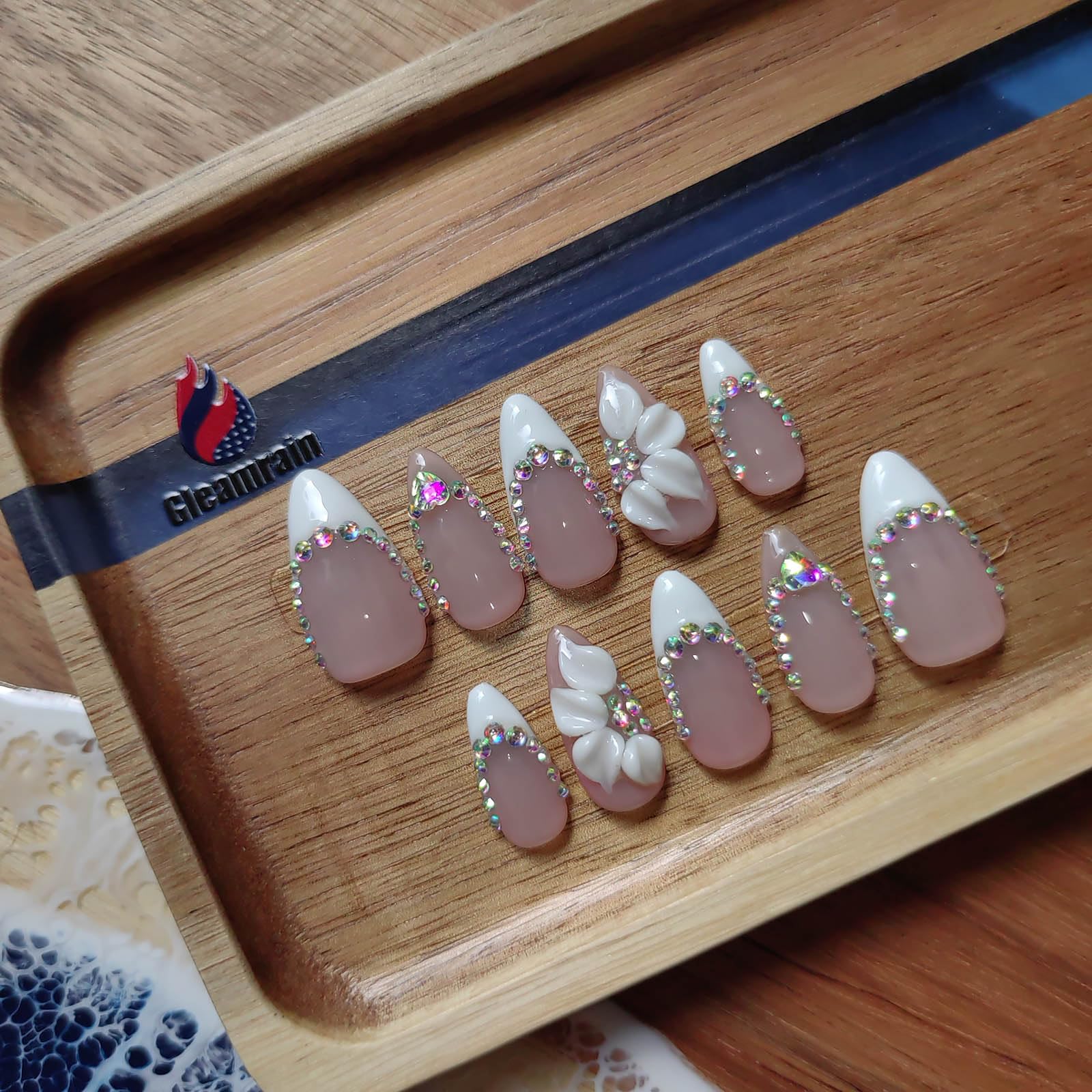 Gleamrain almond nails with a soft pastel base for everyday elegance and easy pairing.